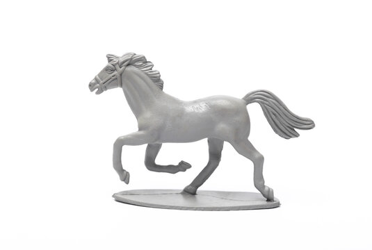 Plastic horse model isolated on white background