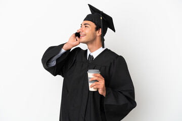 Young university graduate over isolated white background holding coffee to take away and a mobile
