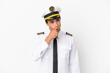 Airplane pilot over isolated white background having doubts and with confuse face expression