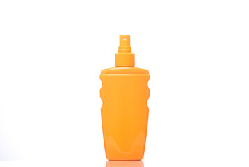 Spray suntan lotion bottle isolated on white background