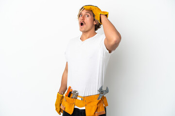Young electrician blonde man isolated on white background doing surprise gesture while looking to the side