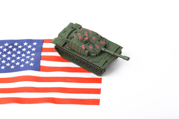 Toy tank with USA flag on white background