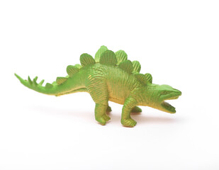 Toy green dinosaur isolated on white background