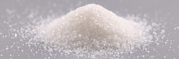 Slide of white sugar on gray background
