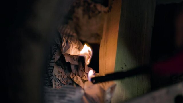 A well-done close-up in slow motion of the start of a fire using paper.   No camera shake, no exposure issues, just the perfect clip requiring a simple fire-starting scene using incendiary paper