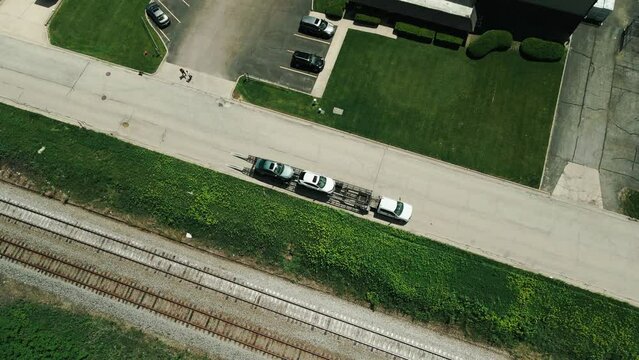 car hauler parked next to railroad  4k drone footage