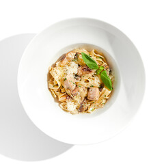 Traditional Italian lunch - pasta fettuccine with chicken and mushrooms with parmesan cheese. Creamy pasta with mushroom and chicken. Chicken and mushroom in cream sauce with homemade pasta.