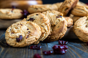 delicious dried cookies made of high-quality flour with dried red cranberries on the table