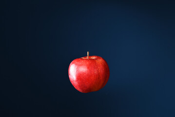 Apple on the dark blue background.