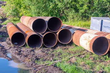 piles for the construction of a bridge across the river, selective focus