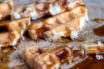 square sweet soft waffles in bee honey