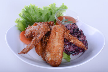 Fried chicken with sticky rice.  on white bowl for Thai food and isolate background 