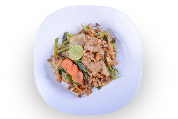 Stir-fried Noodles in Sweet Soy Sauce with Pork ( Pad See-Ew ) on white bowl for Thai food and isolate background with clipping path