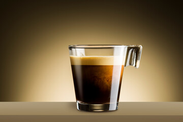 Black coffee in glass cup on brown background