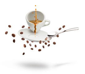 cup of coffee with coffee beans, saucer, and spoon floating on white background.