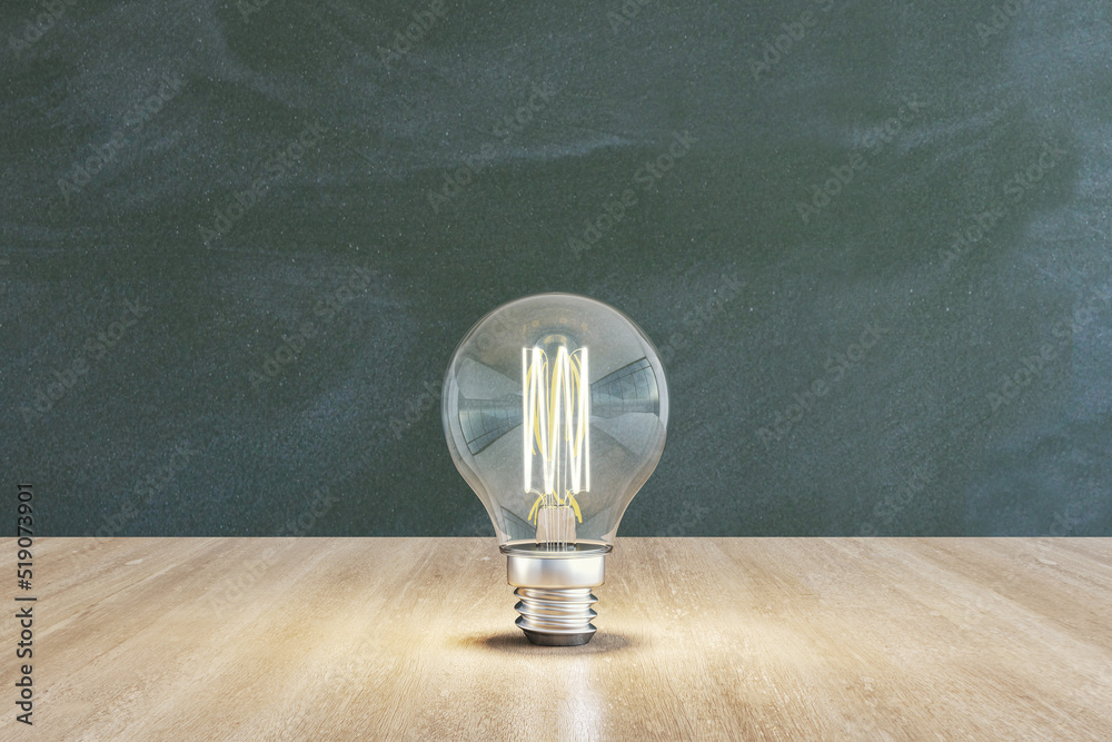 Poster Close up of illuminated light bulb with filament on wooden and chalkboard wall background. New idea and innovation concept. 3D Rendering.