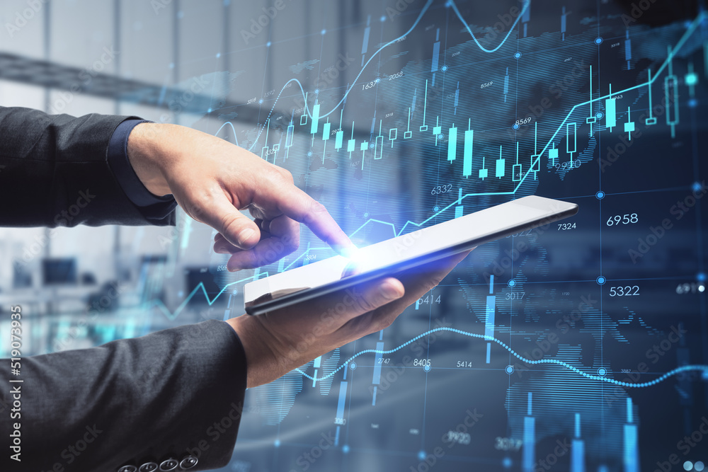 Poster close up of businessman hand pointing at tablet with creative glowing forex chart hologram with map 
