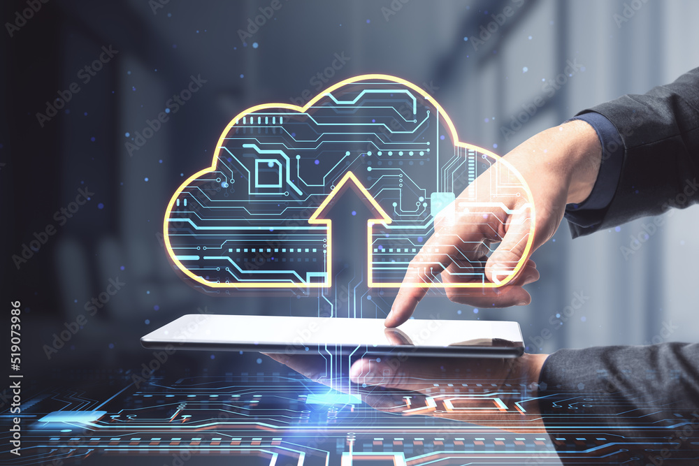 Poster close up of businessman hands pointing at tablet with glowing circuit cloud hologram on blurry offic