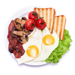 Fried eggs, bacon, tomato and toasted bread in ceramic plate isolated on white background
