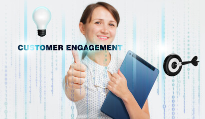 Obraz premium Business, Technology, Internet and network concept. Young businessman working on a virtual screen of the future and sees the inscription: Customer engagement