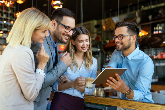 Business people having fun and chatting at workplace office