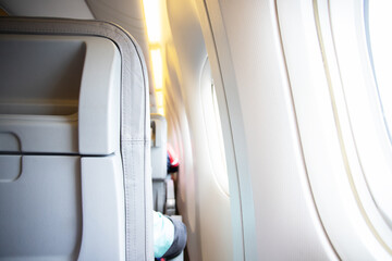aircraft inside, rows of passenger seats and windows