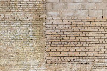 an old brick wall made of a large number of different types of bricks