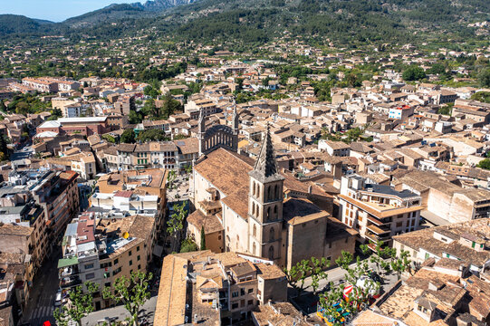Spain, Balearic Islands, Soller, Helicopter view of Church of Saint Bartholomew and surrounding houses in summer