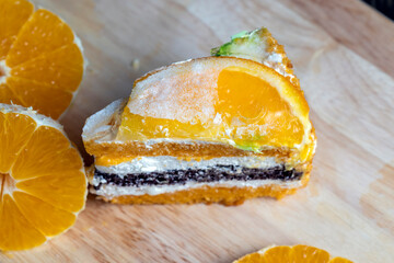 sliced fresh oranges and a piece of orange dessert
