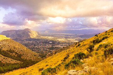Obraz premium amazing evening view from high mountains to a big city in valley below