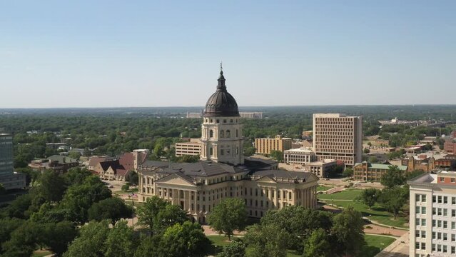 Kansas state capitol building in Topeka, Kansas close up with drone video moving forward at an angle.