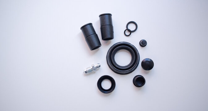 A set of round black rubber bands on a white isolate. Repair kit for the brake system on a white background.  Rubber seals for the automotive system.