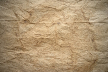 Photo of the texture of old yellowed paper. Crumpled paper with stains. Texture for aging text or photos. The blank background of the manuscript.