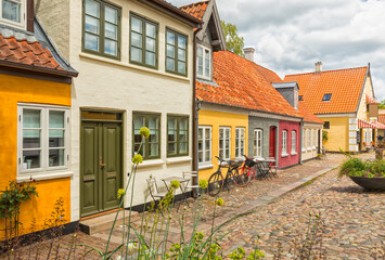 Fototapeta na wymiar Idyllic cobbblestone alley at the old town of Odense, Denmark