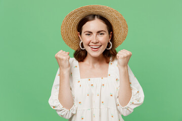 Young happy excited woman she 20s wear white dress hat doing winner gesture celebrate clenching...