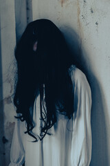 Girl ghost woman death the horror is screaming darkness and nightmare background of scary fear on...