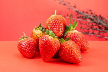 Strawberry isolated in red background 