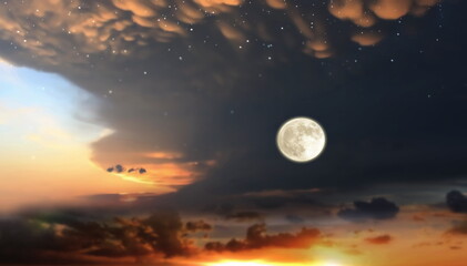 Fototapeta na wymiar orange dramatic sunset on wild field sun down and moon rise on starry cloudy sky 
