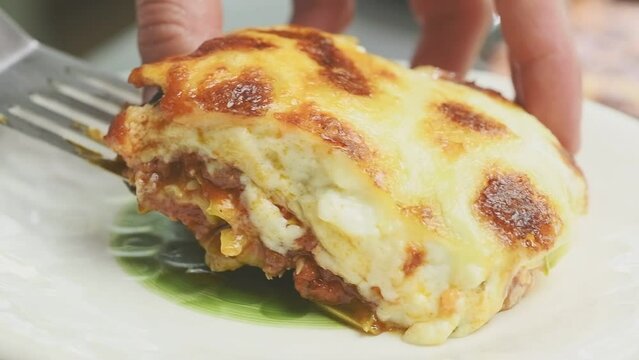 Serving courgette lasagna in a plate.
