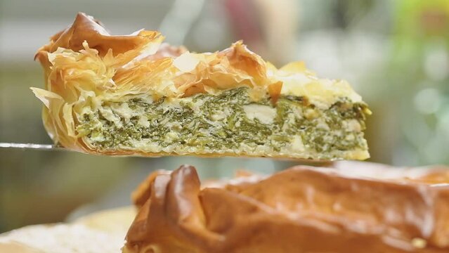 Piece of spinach pie with filo pastry.
