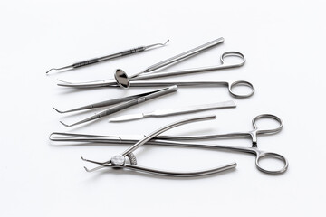 Stack of surgical medical steel equipment at surgery desk