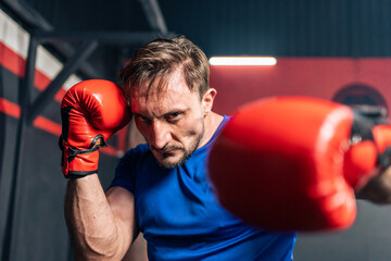 Portrait Caucasian professional sport young man exercising in fitness. 