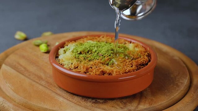 Kanafeh, traditional middle eastern dessert soaked in a sweet syrup.