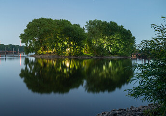 Fototapeta na wymiar reflection of trees in the lake (lighter)