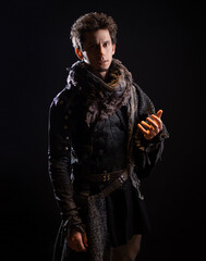 A guy in a steampunk or post-apocalyptic image, portrait on a black background