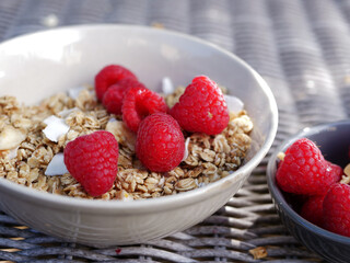 Granola and raspberries for a healthy breakfast