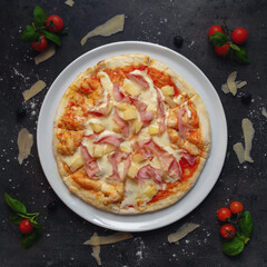 Traditional Italian Pizza Hawaii Style, With Tomato sauce, Ham from Prague and Pineapple , Top Down Shoot, Appetizing Background