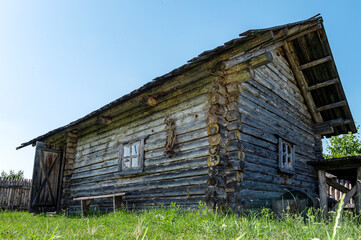 Old authentic wooden house. Remnants of Ancient house. Ancient traditional ukrainian rural cottage.