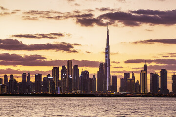 Fototapeta premium Skyscrapers skyline of Dubai UAE downtown with Burj Khalifa at sunset