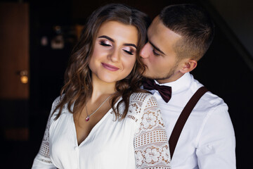 A girl with a beautiful makeup and hairdo closed her eyes. The g